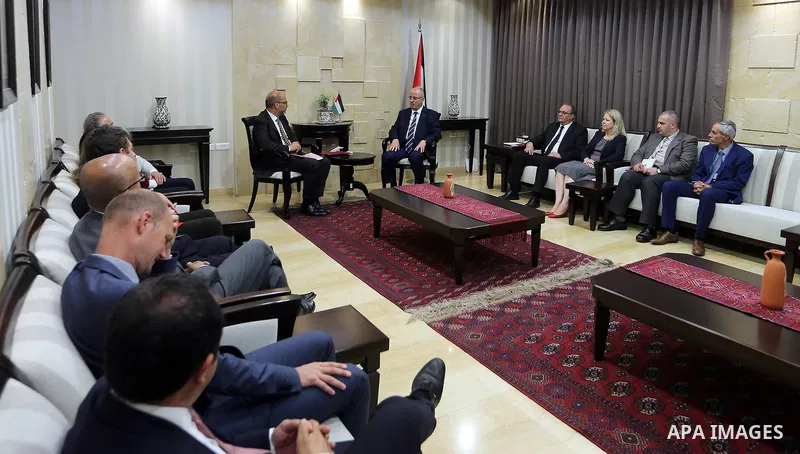 Palestinian Prime Minister Rami Hamdallah attends signing an agreement with United Nation, in the West Bank city of Ramallah on June 15, 2017. Photo by Prime Minister Office