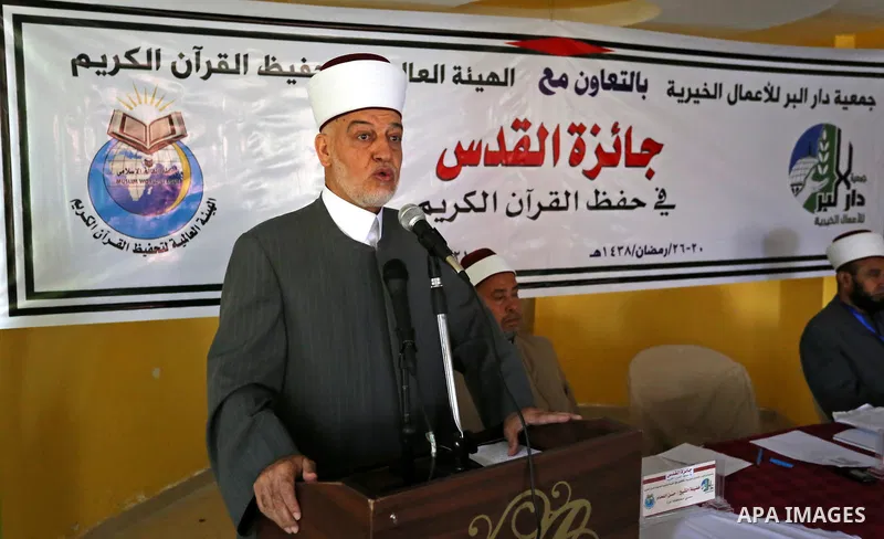 Preacher of Al-Aqsa Mosque, Sheikh Yusuf Juma Salameh speaks during the ceremony of Conservation of the holy Koran competition "Jerusalem Prize", in Gaza city on June 15, 2017. Photo by Ashraf Amra