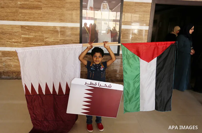 Palestinians take part in a rally in support of Qatar, inside a hospital funded by Qatar in Gaza City, on June 15, 2017. Photo by Ashraf Amra