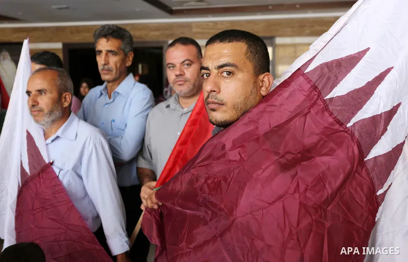 Palestinians take part in a rally in support of Qatar, inside a hospital funded by Qatar in Gaza City, on June 15, 2017. Photo by Ashraf Amra