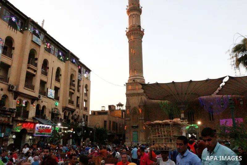 Egyptian muslims take their breakfast during the holy fasting month of Ramadan in front of al-Hussein mosque at Al-Azhar district in old Islamic Cairo, Egypt, on June 17, 2017. Ramadan is sacred to Muslims because it is...