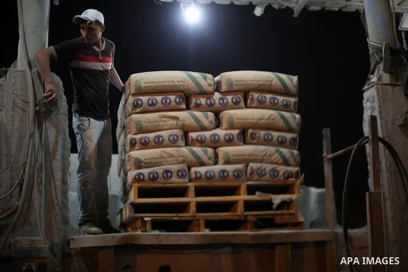 A Palestinian labourer works at a cement factory at night, to avoid the day time heat, on the Muslim holy fasting month of Ramadan in Gaza city on June 17, 2017. Ramadan is sacred to Muslims because it is during that mon...