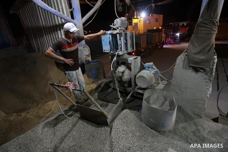 A Palestinian labourer works at a cement factory at night, to avoid the day time heat, on the Muslim holy fasting month of Ramadan in Gaza city on June 17, 2017. Ramadan is sacred to Muslims because it is during that mon...