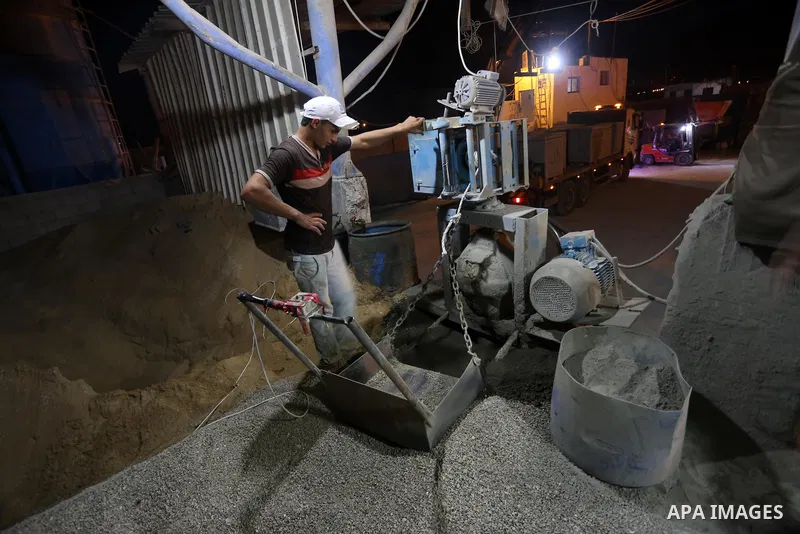 A Palestinian labourer works at a cement factory at night, to avoid the day time heat, on the Muslim holy fasting month of Ramadan in Gaza city on June 17, 2017. Ramadan is sacred to Muslims because it is during that mon...