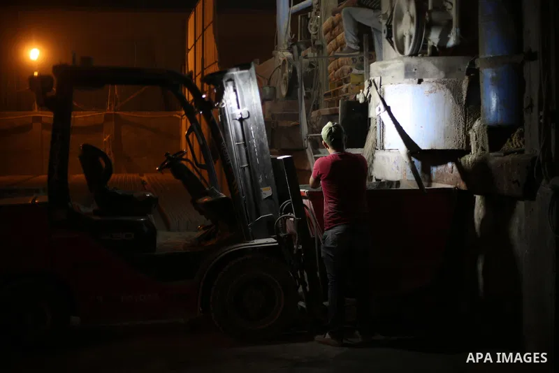 A Palestinian labourer works at a cement factory at night, to avoid the day time heat, on the Muslim holy fasting month of Ramadan in Gaza city on June 17, 2017. Ramadan is sacred to Muslims because it is during that mon...