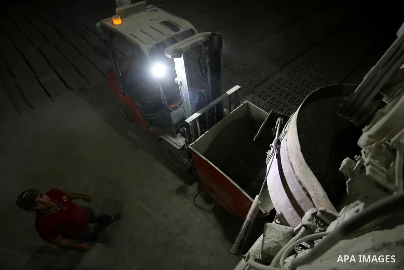 A Palestinian labourer works at a cement factory at night, to avoid the day time heat, on the Muslim holy fasting month of Ramadan in Gaza city on June 17, 2017. Ramadan is sacred to Muslims because it is during that mon...