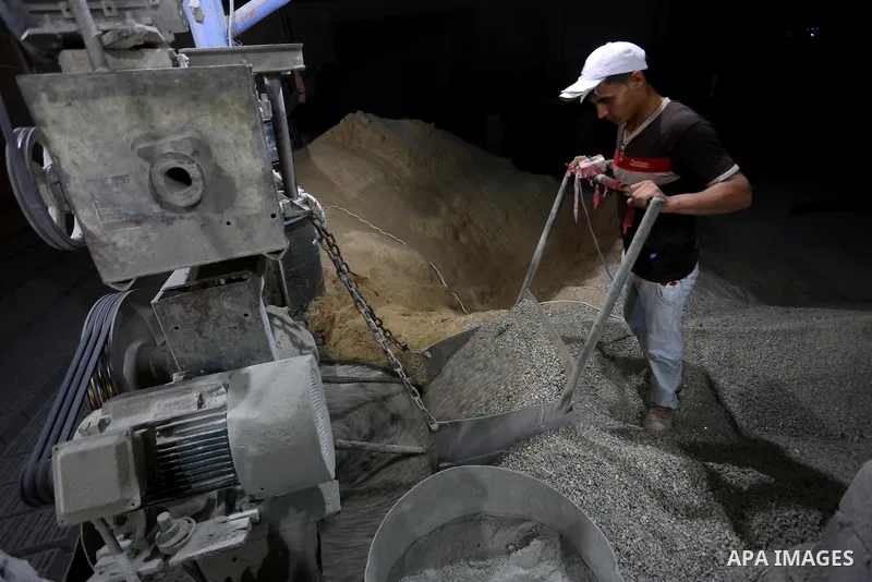 A Palestinian labourer works at a cement factory at night, to avoid the day time heat, on the Muslim holy fasting month of Ramadan in Gaza city on June 17, 2017. Ramadan is sacred to Muslims because it is during that mon...
