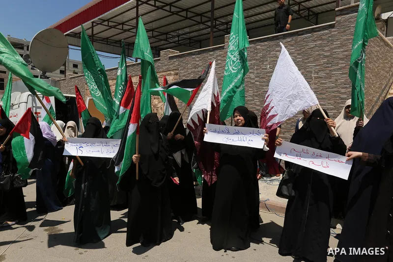 Palestinian women take part in a rally in support of Qatar and against the blockade on the Gaza Strip, in front of the Legislative Council in Gaza city on June 18, 2017. Photo by Ashraf Amra