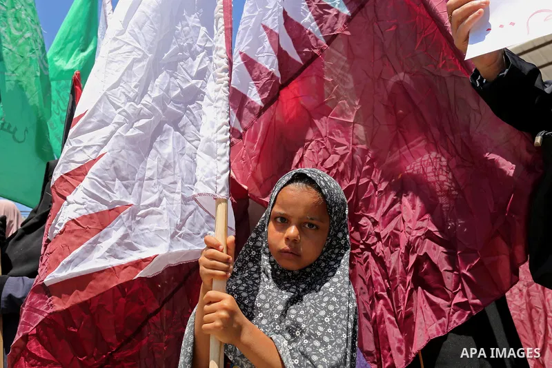 Palestinian women take part in a rally in support of Qatar and against the blockade on the Gaza Strip, in front of the Legislative Council in Gaza city on June 18, 2017. Photo by Ashraf Amra