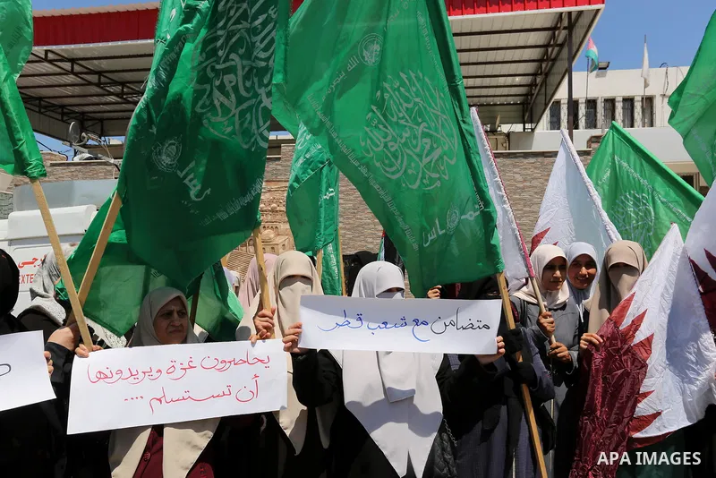 Palestinian women take part in a rally in support of Qatar and against the blockade on the Gaza Strip, in front of the Legislative Council in Gaza city on June 18, 2017. Photo by Ashraf Amra