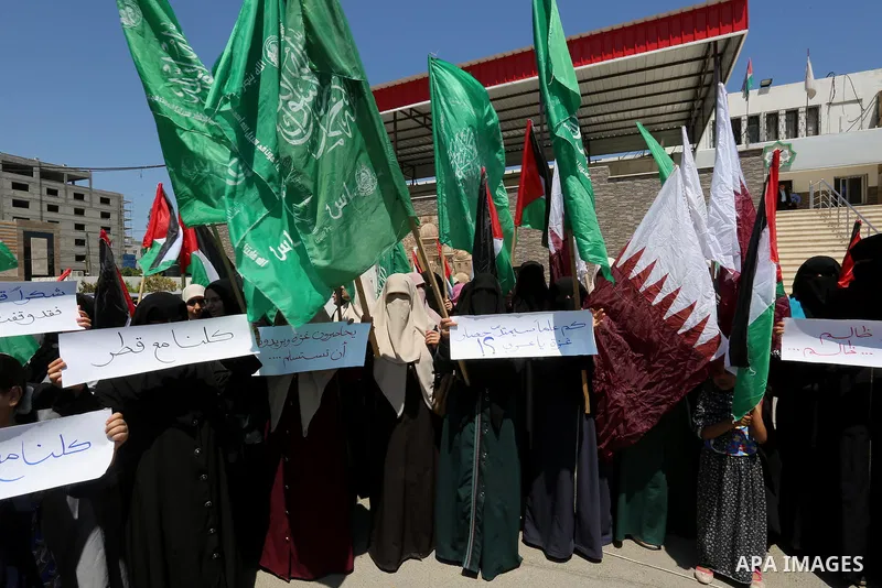 Palestinian women take part in a rally in support of Qatar and against the blockade on the Gaza Strip, in front of the Legislative Council in Gaza city on June 18, 2017. Photo by Ashraf Amra