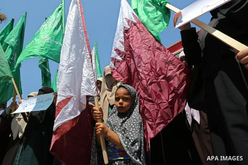 Palestinian women take part in a rally in support of Qatar and against the blockade on the Gaza Strip, in front of the Legislative Council in Gaza city on June 18, 2017. Photo by Ashraf Amra