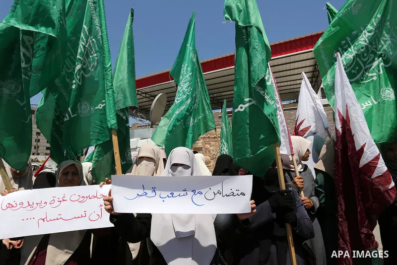 Palestinian women take part in a rally in support of Qatar and against the blockade on the Gaza Strip, in front of the Legislative Council in Gaza city on June 18, 2017. Photo by Ashraf Amra
