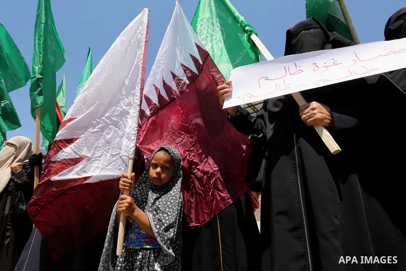 Palestinian women take part in a rally in support of Qatar and against the blockade on the Gaza Strip, in front of the Legislative Council in Gaza city on June 18, 2017. Photo by Ashraf Amra