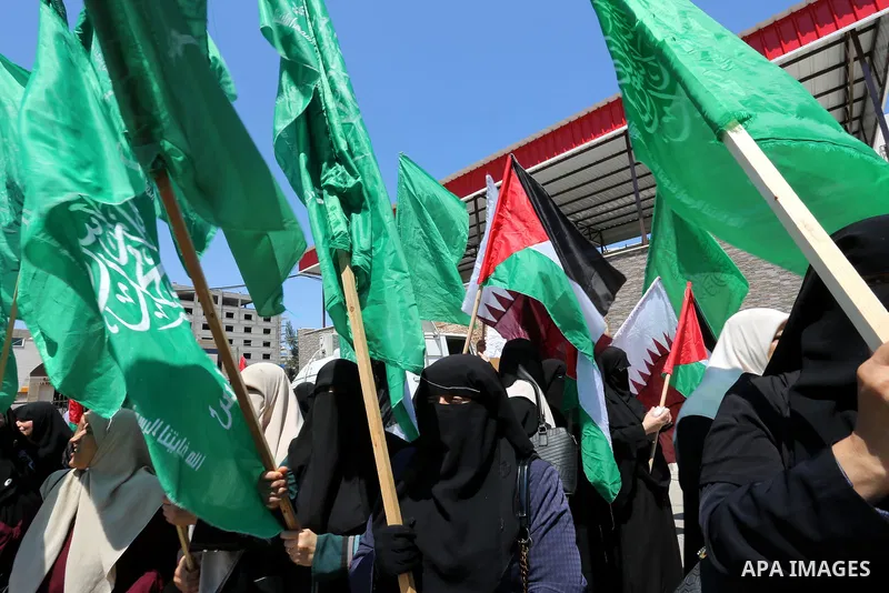 Palestinian women take part in a rally in support of Qatar and against the blockade on the Gaza Strip, in front of the Legislative Council in Gaza city on June 18, 2017. Photo by Ashraf Amra