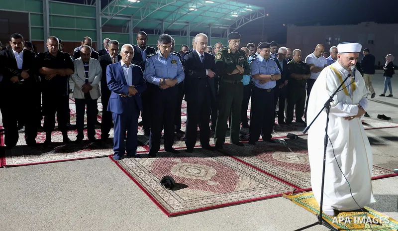 Palestinian Prime Minister Rami Hamdallah performs prayer after breakfasting with security forces on the Muslim holy fasting month of Ramadan, in the West Bank city of Jenin on June 18, 2017. Photo by Prime Minister Offi...