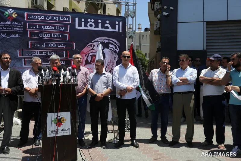 Palestinians take part during a protest to demanding right of patients to travel for treatment, in Gaza city on June 19, 2017. Photo by Mohammed Asad