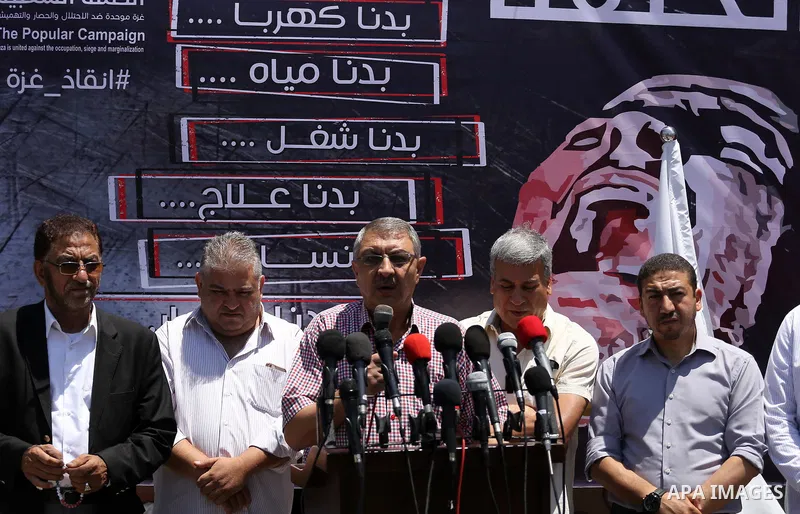 Palestinians take part during a protest to demanding right of patients to travel for treatment, in Gaza city on June 19, 2017. Photo by Mohammed Asad