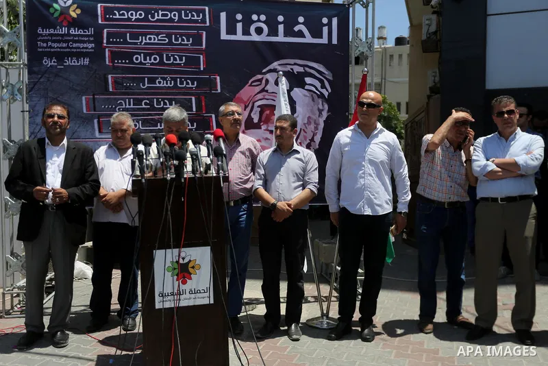 Palestinians take part during a protest to demanding right of patients to travel for treatment, in Gaza city on June 19, 2017. Photo by Mohammed Asad