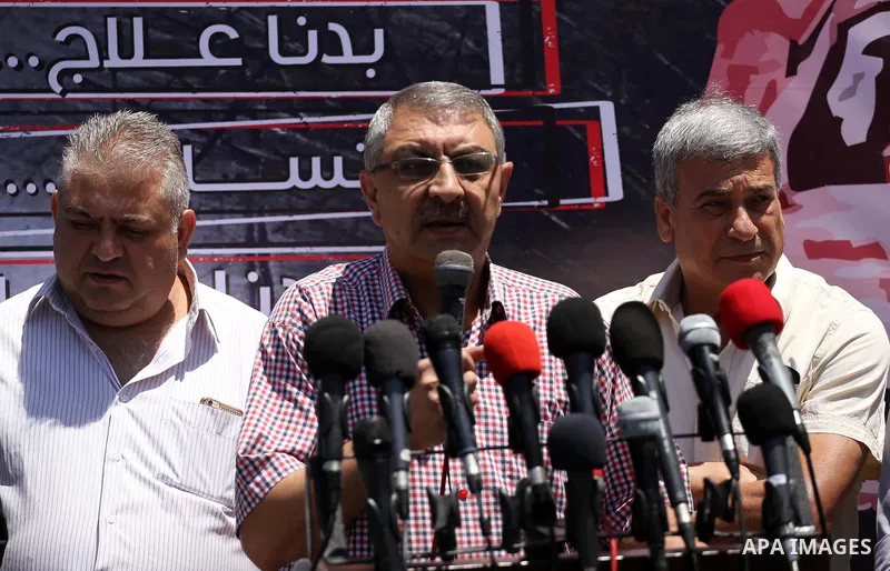 Palestinians take part during a protest to demanding right of patients to travel for treatment, in Gaza city on June 19, 2017. Photo by Mohammed Asad