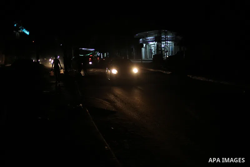 A general view shows Gaza City in the evening hours during a power cut, on June 19, 2017. Photo by Mohammed Asad