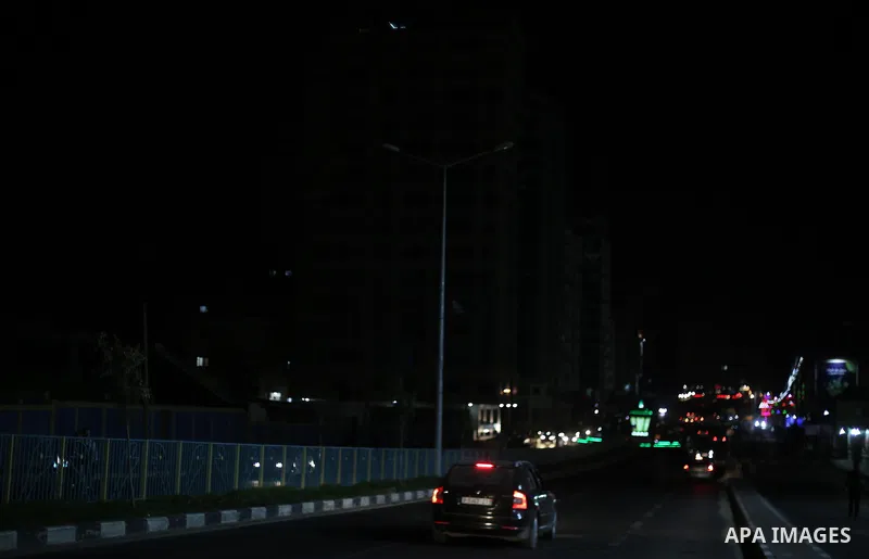 A general view shows Gaza City in the evening hours during a power cut, on June 19, 2017. Photo by Mohammed Asad