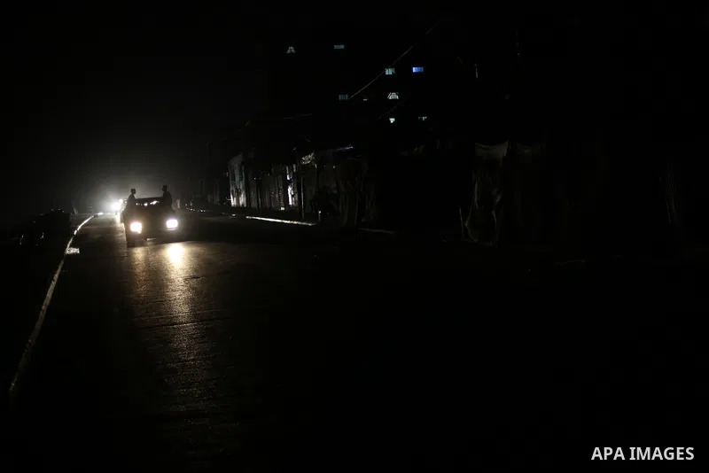 A general view shows Gaza City in the evening hours during a power cut, on June 19, 2017. Photo by Mohammed Asad