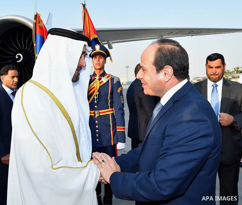 Egyptian President Abdel Fattah al-Sis welcomes to Abu Dhabi Crown Prince Sheikh Mohammed bin Zayed al-Nahyan after he arrives in Cairo International Airport on June 19, 2017. Photo by Egyptian President Office