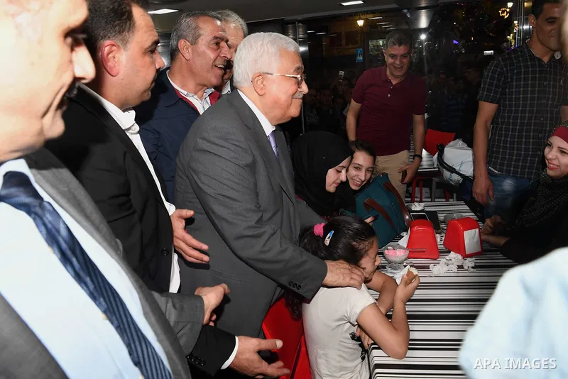 Palestinian President Mahmoud Abbas roams at the streets on the West Bank city of Ramallah on June 20, 2017. Photo by Thaer Ganaim