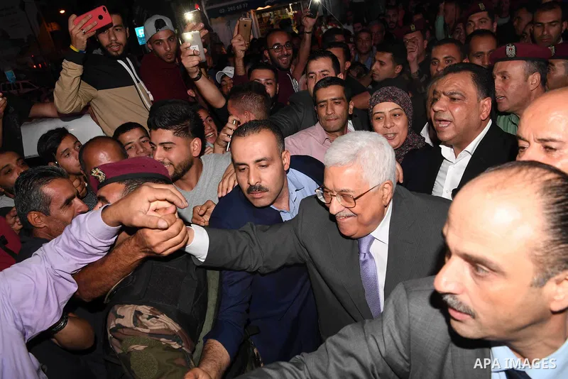 Palestinian President Mahmoud Abbas roams at the streets on the West Bank city of Ramallah on June 20, 2017. Photo by Thaer Ganaim