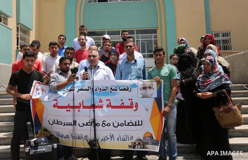 Palestinians take part during a protest to demanding the right of Cancer's patients to travel for treatment, in Gaza city on June 21, 2017. Photo by Mohammed Asad