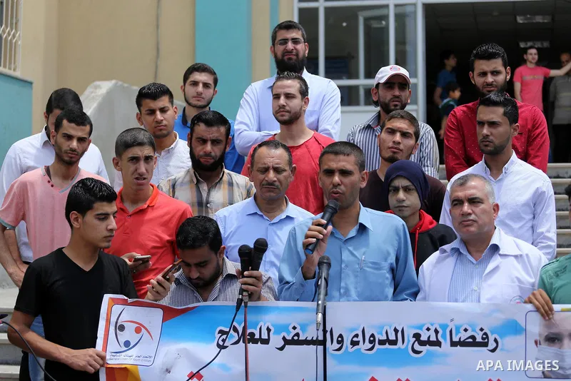 Palestinians take part during a protest to demanding the right of Cancer's patients to travel for treatment, in Gaza city on June 21, 2017. Photo by Mohammed Asad