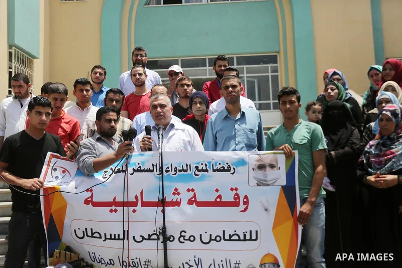 Palestinians take part during a protest to demanding the right of Cancer's patients to travel for treatment, in Gaza city on June 21, 2017. Photo by Mohammed Asad