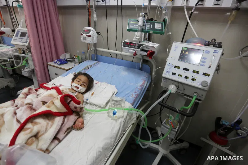 A Palestinian child with cancer receives treatment at the hospital in Gaza city on June 21, 2017. Photo by Mohammed Asad