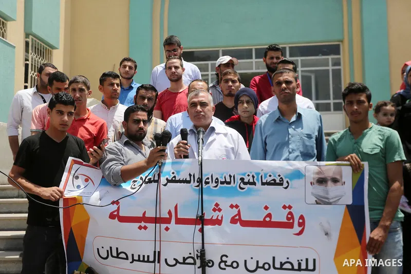 Palestinians take part during a protest to demanding the right of Cancer's patients to travel for treatment, in Gaza city on June 21, 2017. Photo by Mohammed Asad
