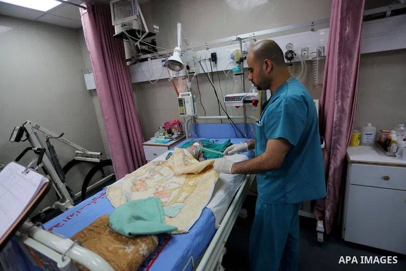 A Palestinian child with cancer receives treatment at the hospital in Gaza city on June 21, 2017. Photo by Mohammed Asad