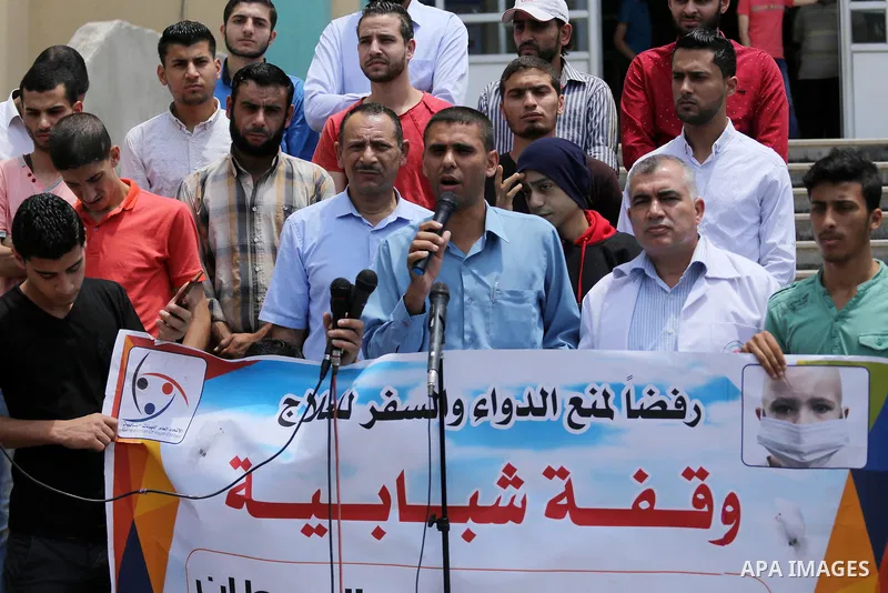 Palestinians take part during a protest to demanding the right of Cancer's patients to travel for treatment, in Gaza city on June 21, 2017. Photo by Mohammed Asad