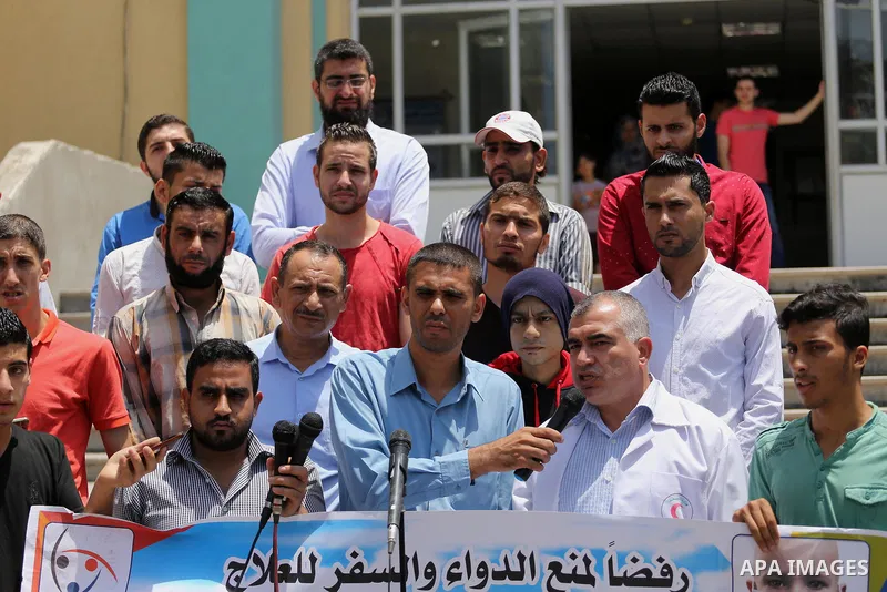 Palestinians take part during a protest to demanding the right of Cancer's patients to travel for treatment, in Gaza city on June 21, 2017. Photo by Mohammed Asad