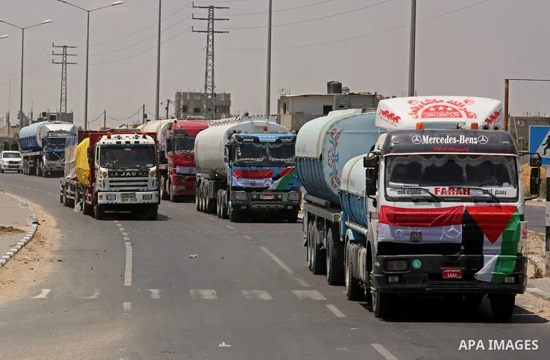 Egyptian trucks carrying fuel drive down a street after entering the southern Gaza Strip from Egypt through the Rafah border crossing on June 21, 2017. Egypt began to deliver a million litres of fuel to Gaza, a Palestini...