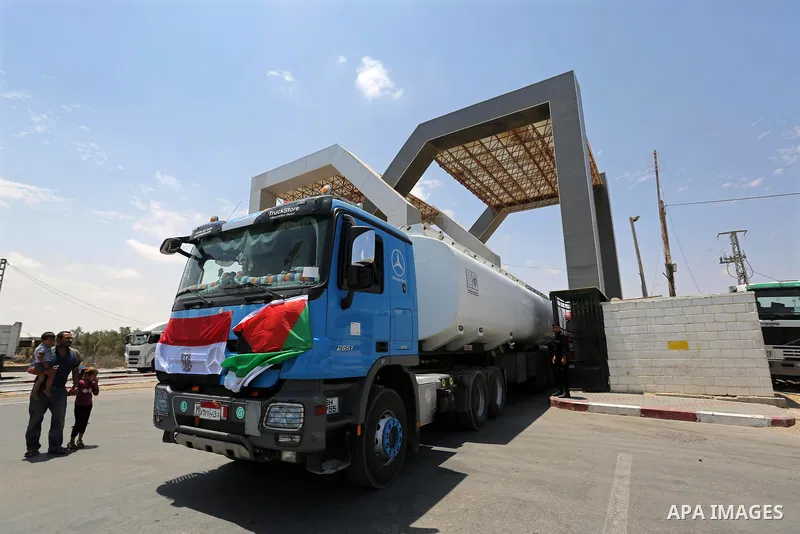 Egyptian trucks carrying fuel are seen enter the southern Gaza Strip from Egypt through the Rafah border crossing on June 21, 2017. Egypt began to deliver a million litres of fuel to Gaza, a Palestinian official said, in...