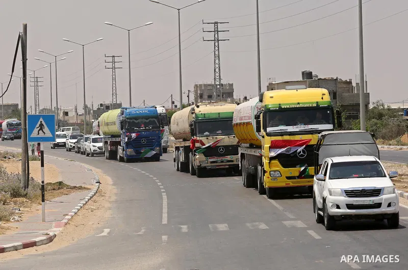 Egyptian trucks carrying fuel drive down a street after entering the southern Gaza Strip from Egypt through the Rafah border crossing on June 21, 2017. Egypt began to deliver a million litres of fuel to Gaza, a Palestini...