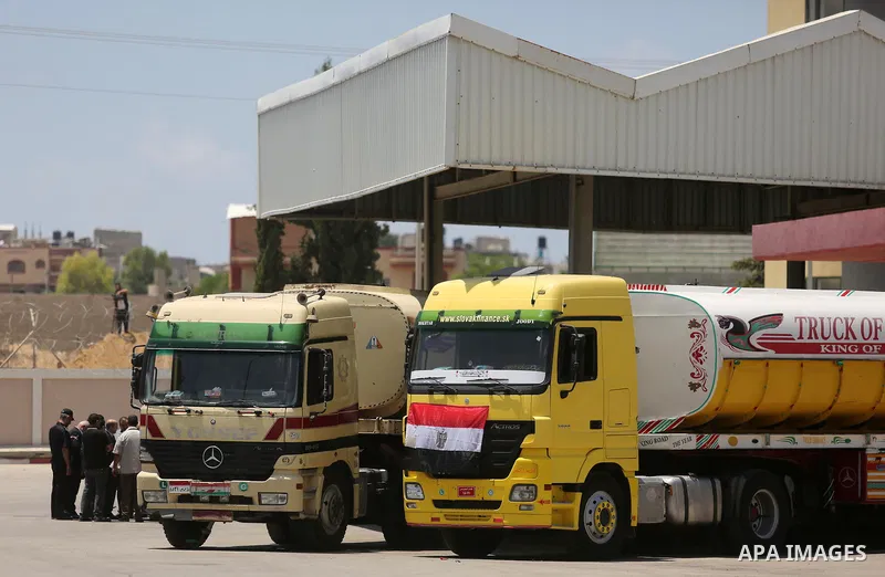 Egyptian trucks carrying fuel arrive to Gaza's power plant in Nusseirat, in the central Gaza Strip after entering the southern Gaza Strip from Egypt through the Rafah border crossing on June 21, 2017. Egypt began to deli...