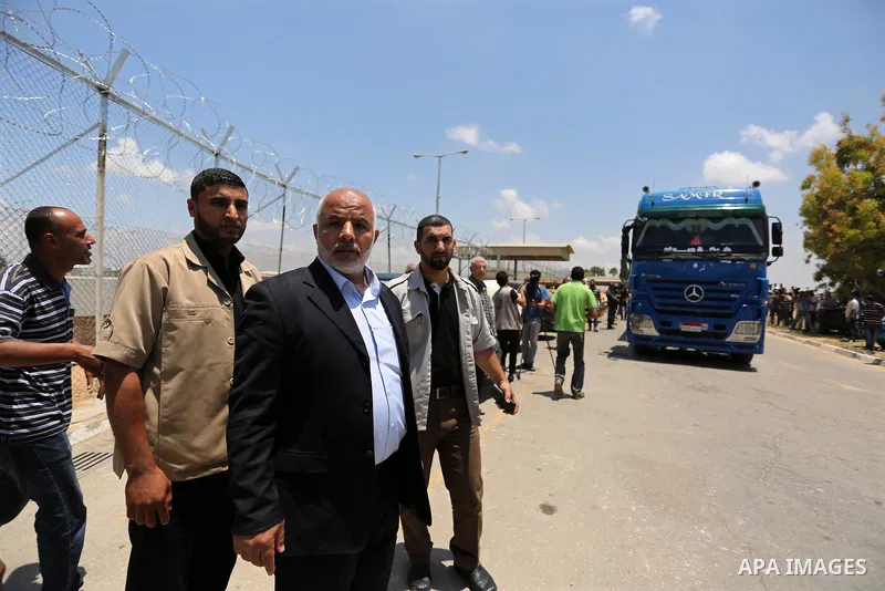 Tawfiq Abu Naim Undersecretary of the Ministry of Interior inspects arrival of Egyptian trucks carrying fuel Gaza's power plant in Nusseirat, in the central Gaza Strip after entering the southern Gaza Strip from Egypt th...