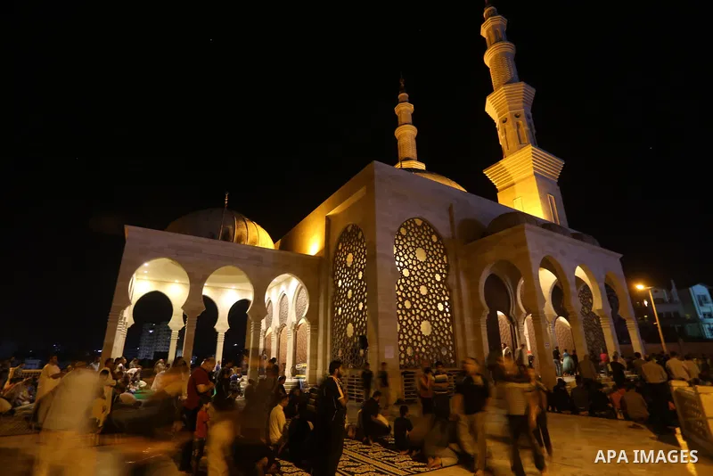 Palestinian Muslim worshippers pray overnight on July 22, 2017 at a Mosque in Gaza city on the occasion of Laylat al-Qadr which falls on the 27th day of the fasting month of Ramadan. Laylat al-Qadr, or Night of Destiny,...