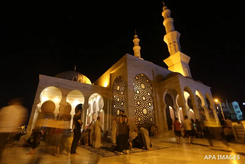 Palestinian Muslim worshippers pray overnight on July 22, 2017 at a Mosque in Gaza city on the occasion of Laylat al-Qadr which falls on the 27th day of the fasting month of Ramadan. Laylat al-Qadr, or Night of Destiny,...