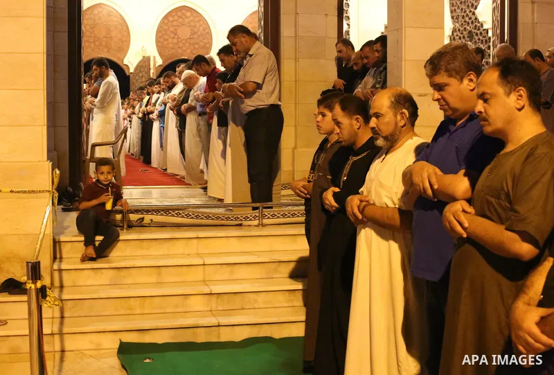 Palestinian Muslim worshippers pray overnight on July 22, 2017 at a Mosque in Gaza city on the occasion of Laylat al-Qadr which falls on the 27th day of the fasting month of Ramadan. Laylat al-Qadr, or Night of Destiny,...