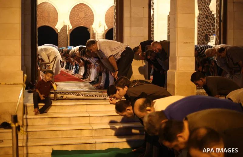 Palestinian Muslim worshippers pray overnight on July 22, 2017 at a Mosque in Gaza city on the occasion of Laylat al-Qadr which falls on the 27th day of the fasting month of Ramadan. Laylat al-Qadr, or Night of Destiny,...