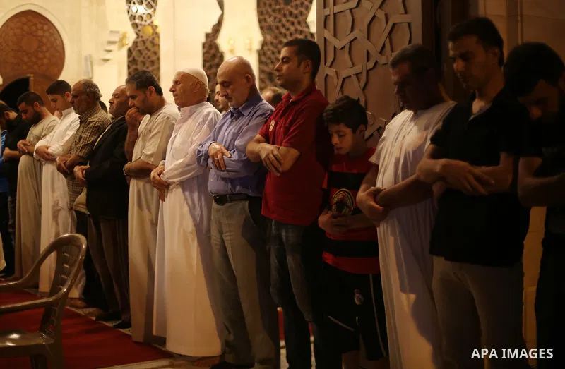 Palestinian Muslim worshippers pray overnight on July 22, 2017 at a Mosque in Gaza city on the occasion of Laylat al-Qadr which falls on the 27th day of the fasting month of Ramadan. Laylat al-Qadr, or Night of Destiny,...