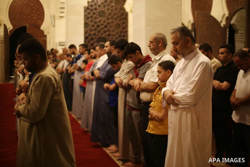 Palestinian Muslim worshippers pray overnight on July 22, 2017 at a Mosque in Gaza city on the occasion of Laylat al-Qadr which falls on the 27th day of the fasting month of Ramadan. Laylat al-Qadr, or Night of Destiny,...