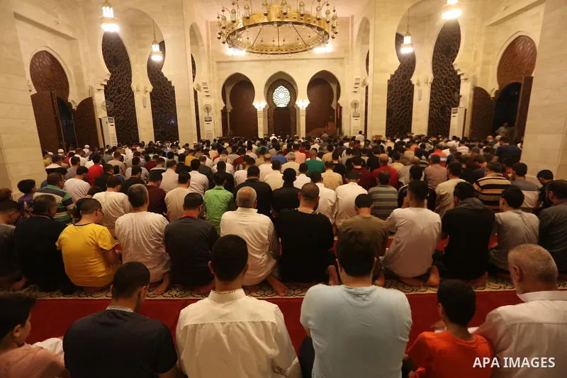 Palestinian Muslim worshippers pray overnight on July 22, 2017 at a Mosque in Gaza city on the occasion of Laylat al-Qadr which falls on the 27th day of the fasting month of Ramadan. Laylat al-Qadr, or Night of Destiny,...